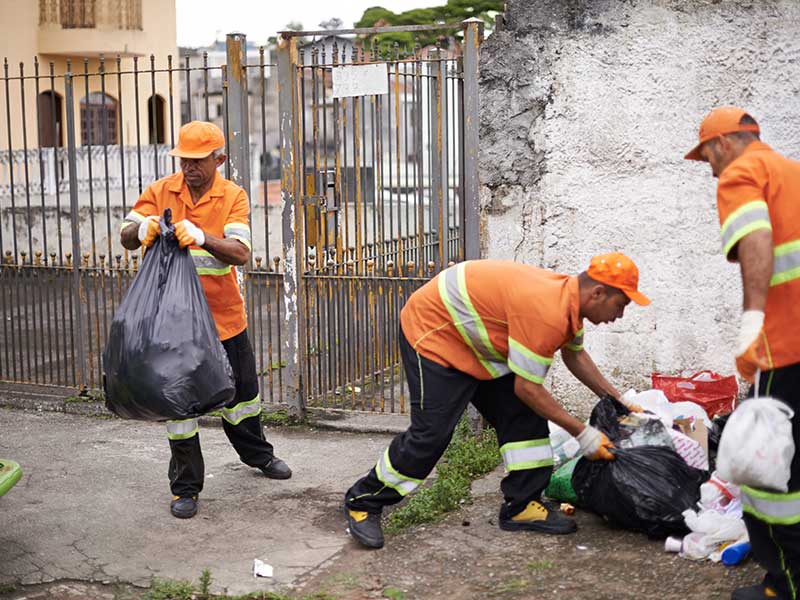 Waste Management wrokers collecting trash