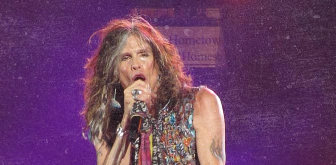 Steven Tyler singing into microphone on stage for band Aerosmith
